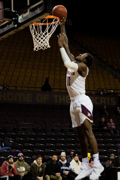 Texas State junior forward Tyrel Morgan (10) goes up for a dunk during a game against Appalachian State, Thursday, Feb. 3, 2022, at Strahan Arena. The Bobcats won 68-66.