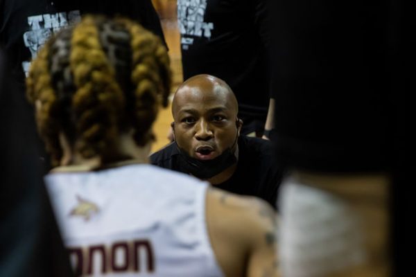 Texas State men's basketball head coach T.J. Johnson talks strategy to junior guard Drue Drinnon (55) during a time out in a game against Appalachian State, Thursday, Feb. 3, 2022, at Strahan Arena. The Bobcats won 68-66.