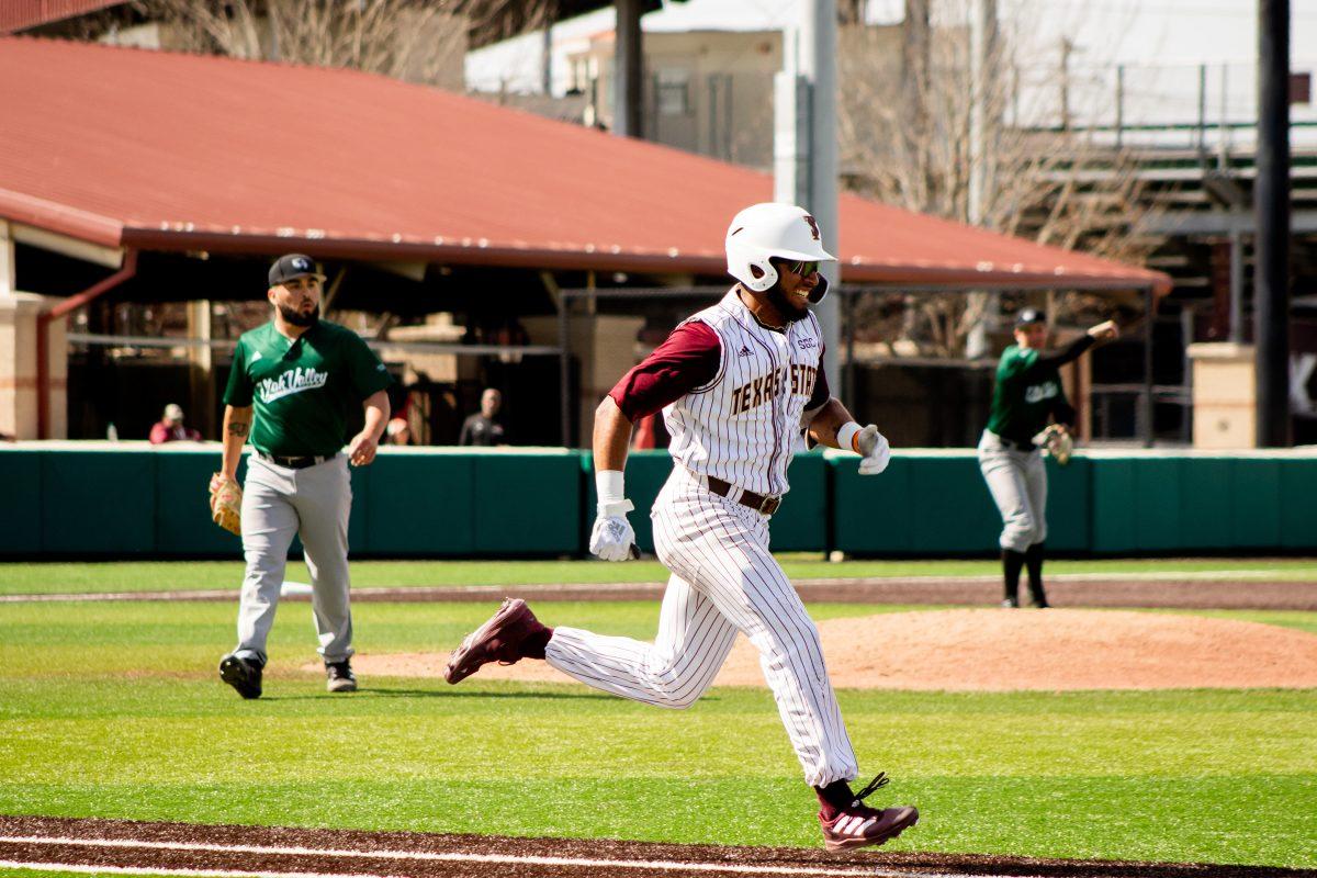 Texas State senior outfielder Isaiah Ortega-Jones (17) advances to first base during a series against Utah Valley, Sunday, Feb. 20, 2022, at Bobcat Ballpark. The Bobcats won the series 3-1.