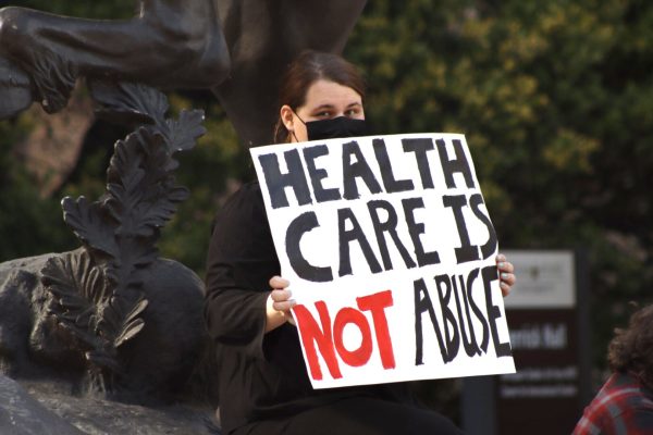 A protestor holds a sign during the March for Trans Youth, Wednesday, March 2, 2022, at the Stallions. The march was organized in response to Gov. Greg Abbott’s recent order directing state officials to handle gender-affirming treatment to minors as child abuse.