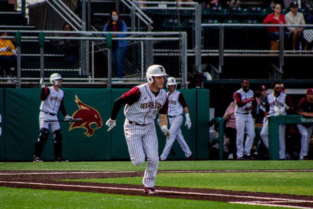 Texas State senior infielder Justin Thompson (10) makes a run for first base during a series against Utah Valley, Sunday, Feb. 20, 2022, at Bobcat Ballpark. The Bobcats won the series 3-1.