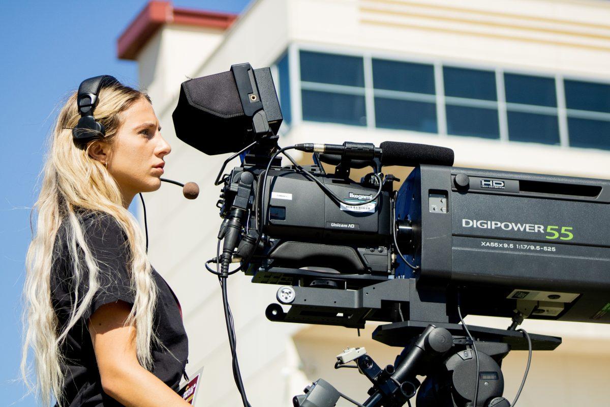 Texas State public relations senior Gabriella Salzillo works as a camera operator for ESPN+ during the spring football game, Saturday, April 24, 2021, at Bobcat Stadium.
