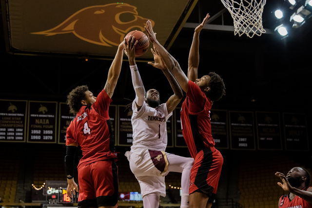 Texas State senior forward Isiah Small (1) attempts to break through the Ragin Cajuns defense during a game against the University of Louisiana, Saturday, Jan. 15, 2022, at Strahan Arena. The Bobcats won 72-68.