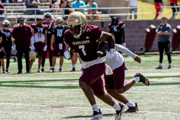 Texas State senior wide receiver Toe Groves (7) runs downfield with the ball during the spring football game, Saturday, April 9, 2022, at Bobcat Stadium.