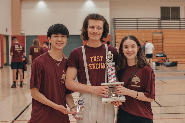Texas State Fencing awarded Top Sabre Squad of SWIFA III, pictured afterward. Left to right: junior Peter Cu; freshman Jengo Russell; freshman Maddy McJilton. Saturday, April 16th, 2022