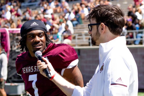 Texas State senior wide receiver Toe Groves (7) answers interview questions from Texas State Athletics TV announcer Brant Freeman during the spring football game, Saturday, April 9, 2022, at Bobcat Stadium.