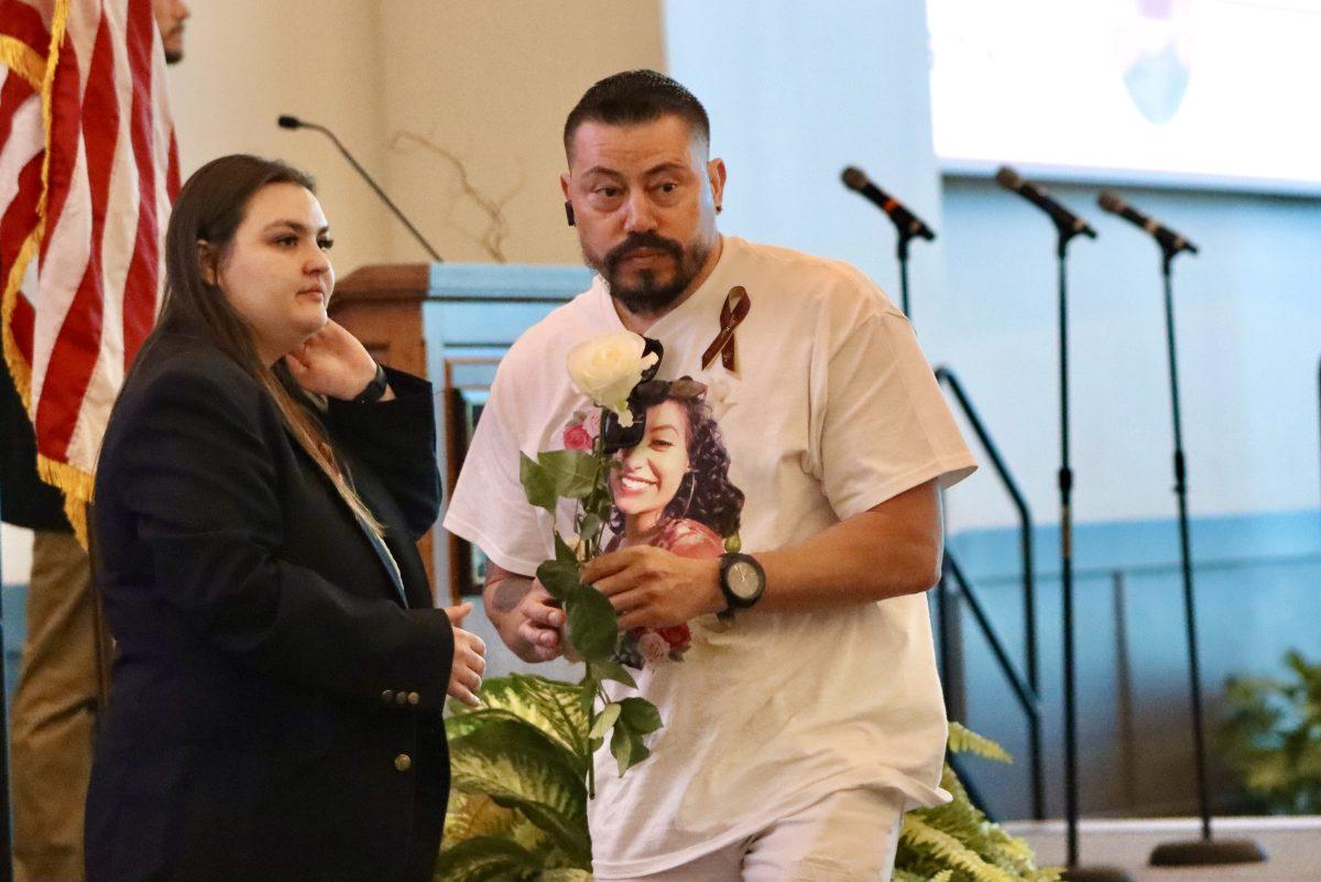 Jose “Joel” Velez, Iliana Velez’s father, accepts a white rose in memory of his daughter during the Bobcat Pause memorial service, Thursday, April 7, 2022, at the LBJSC Ballroom. Iliana, 19, was killed in a hit-and-run car collision on Interstate 35 in January. She was studying architecture and interior design at Texas State.