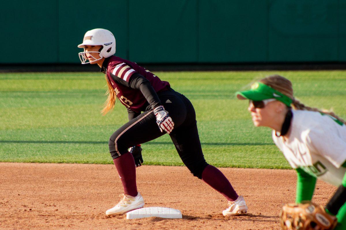 Texas+State+senior+catcher+Caitlyn+Rogers+%2813%29+readies+up+to+make+a+run+for+third+base+during+the+home+opener+against+the+University+of+Oregon%2C+Thursday%2C+Feb.+17%2C+2022%2C+at+Bobcat+Softball+Stadium.+The+Bobcats+lost+3-7.
