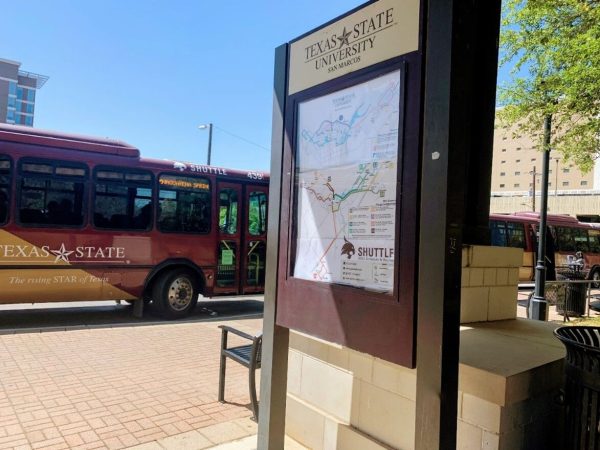 A Bobcat shuttle pulls up to its stop near Jones Dining Hall on March 30, 2022. Bobcat shuttles offer a more sustainable method of transportation for members of the Texas State community.