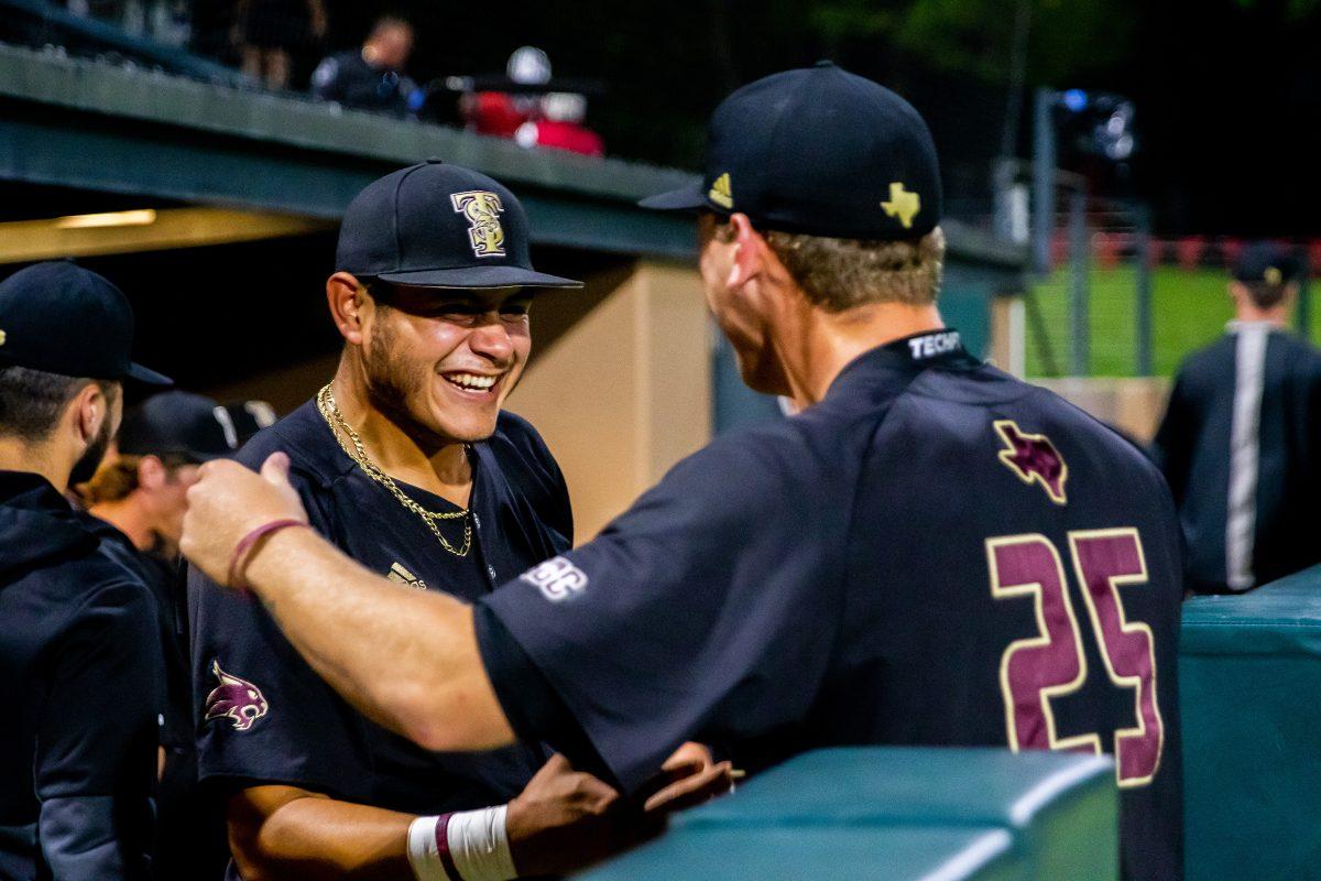 Texas+State+junior+infielder+Jose+Gonzalez+%2823%29+and+sophomore+pitcher+Levi+Wells+%2825%29+embrace+one+another+after+defeating+Stanford+in+game+four+of+the+NCAA+Stanford+Regional%2C+Saturday%2C+June+5%2C+2022%2C+at+Klein+Field+at+Sunken+Diamond+in+Palo+Alto%2C+CA.+The+Bobcats+won+5-2%2C+sending+Texas+State+Baseball+to+an+NCAA+Regional+final+for+the+first+time+in+its+program+history.