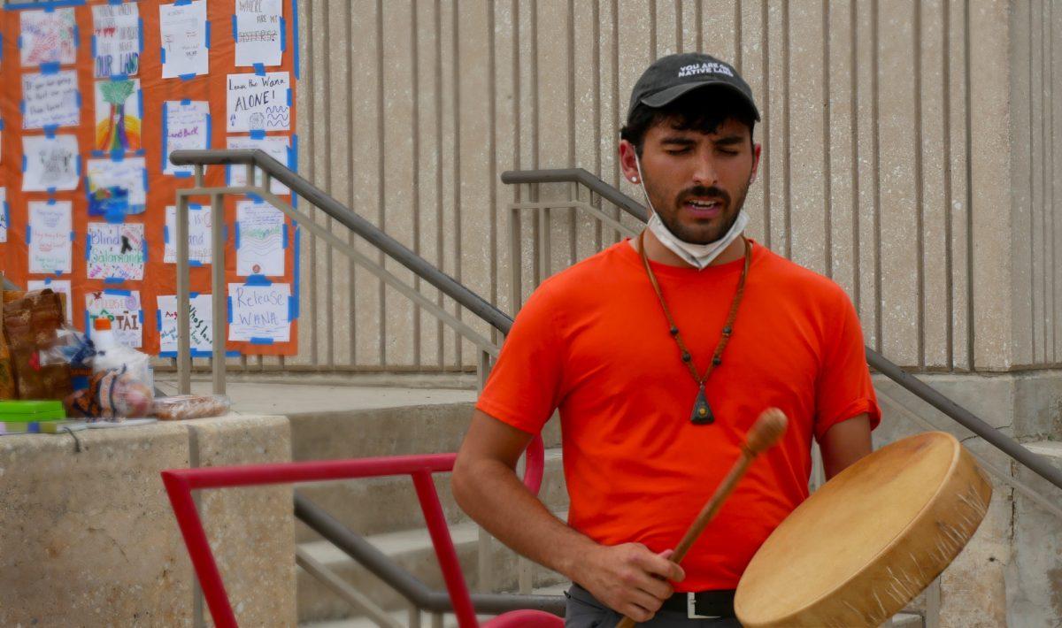 Jose Dominguez leads protesters in an Indigenous Water Song at the Protect The River Protest outside San Marcos City Hall on June 28, 2022.