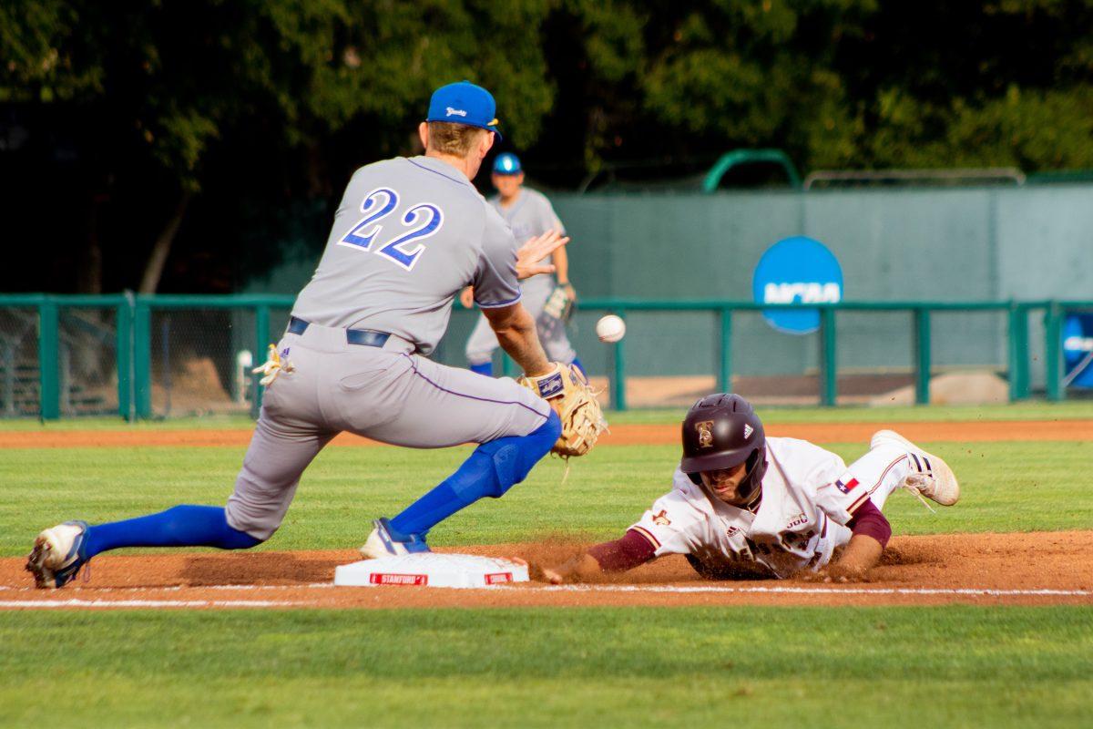 Texas State senior infielder Dalton Shuffield (8) slides back into first base on a pick-off attempt during the Bobcats first game of the NCAA Baseball Stanford Regional against UC Santa Barbara, Friday, June 3, 2022, at Klein Field at Sunken Diamond in Palo Alto, California. The Bobcats defeated the Gauchos 7-3.