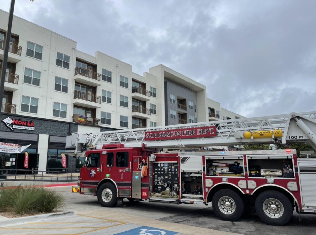 A San Marcos Fire Department truck parked in front of Springtown Center, Tuesday, August 23, 2022 in San Marcos, Texas. Residents and employees inside the building were evacuated because of a gas leak Tuesday morning. 