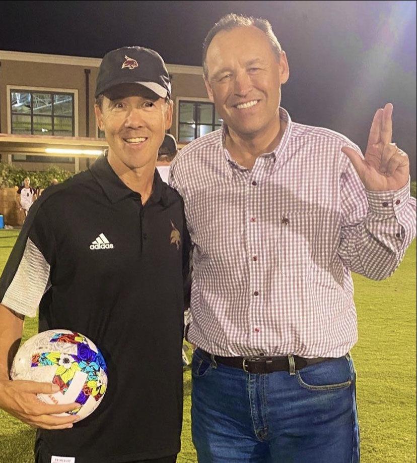 Texas State soccer head coach Steve Holeman gets presented the game ball by Kelly Damphousse after Holemans first win as head coach against the University of St. Marys on Aug. 18.