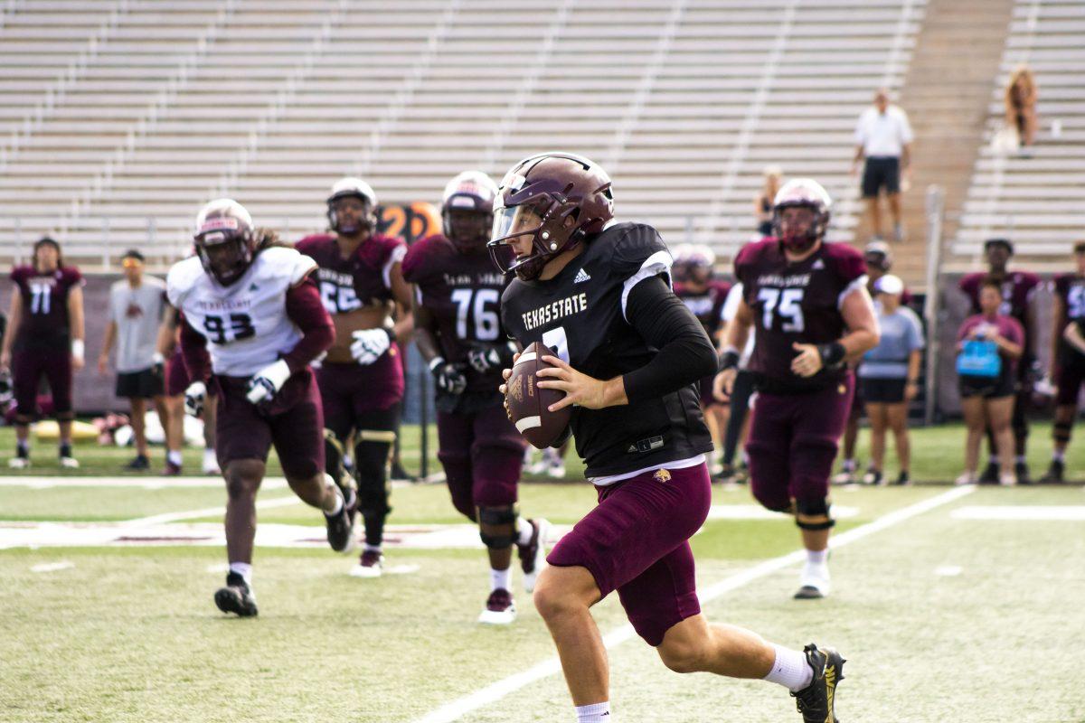 Texas State redshirt junior quarterback Layne Hatcher (3) looks for an open pass during fall camp practice, Saturday, August 20, 2022, at Bobcat Stadium.