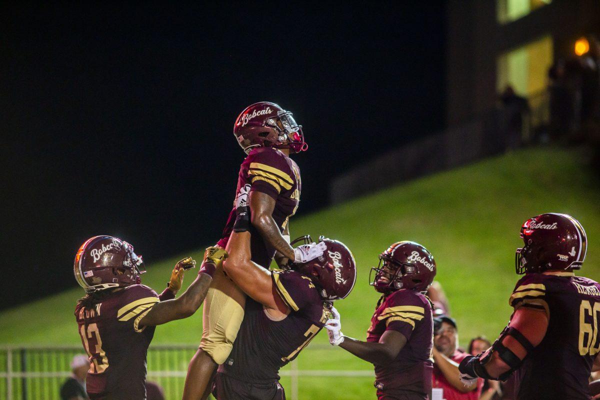 Texas State redshirt sophomore running back Calvin Hill (11) celebrates with his teammates after scoring a touchdown during a game against Florida International University, Saturday, Sept. 10, 2022, at Bobcat Stadium. The Bobcats defeated the Panthers 41-12.