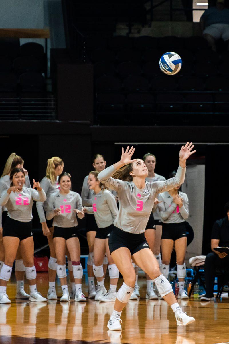 Texas State freshman outside hitter Maggie Walsh (3) serves the ball during a match against James Madison University, Saturday, Oct. 1, 2022, at Strahan Arena. The Bobcats tied the weekend series 1-1.