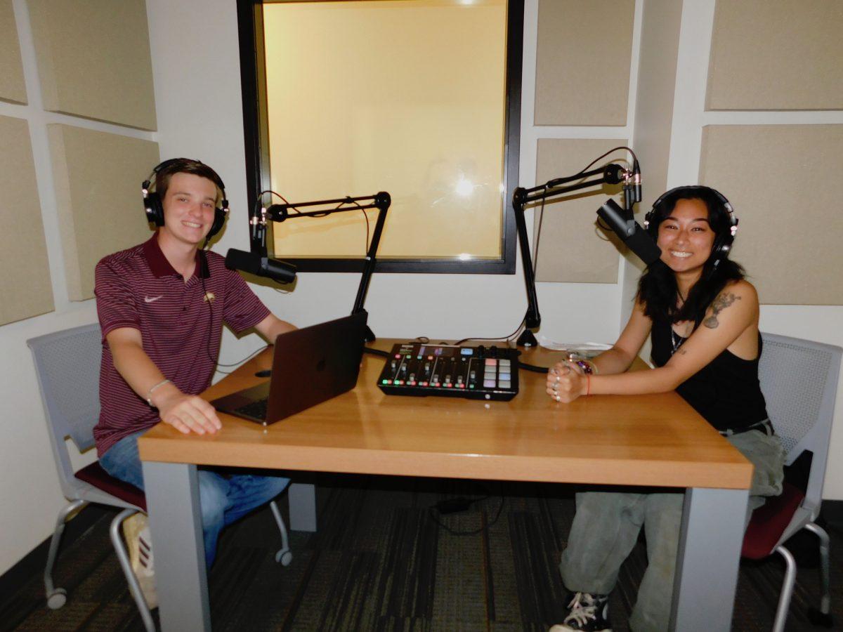 Texas State public health pre-med freshman Zack Caviness (left) and nursing freshman Shay Tran record their podcast, Hot Health!, Thursday, Oct. 13, 2022, in the Alkek One Youstar Studio recording room.
