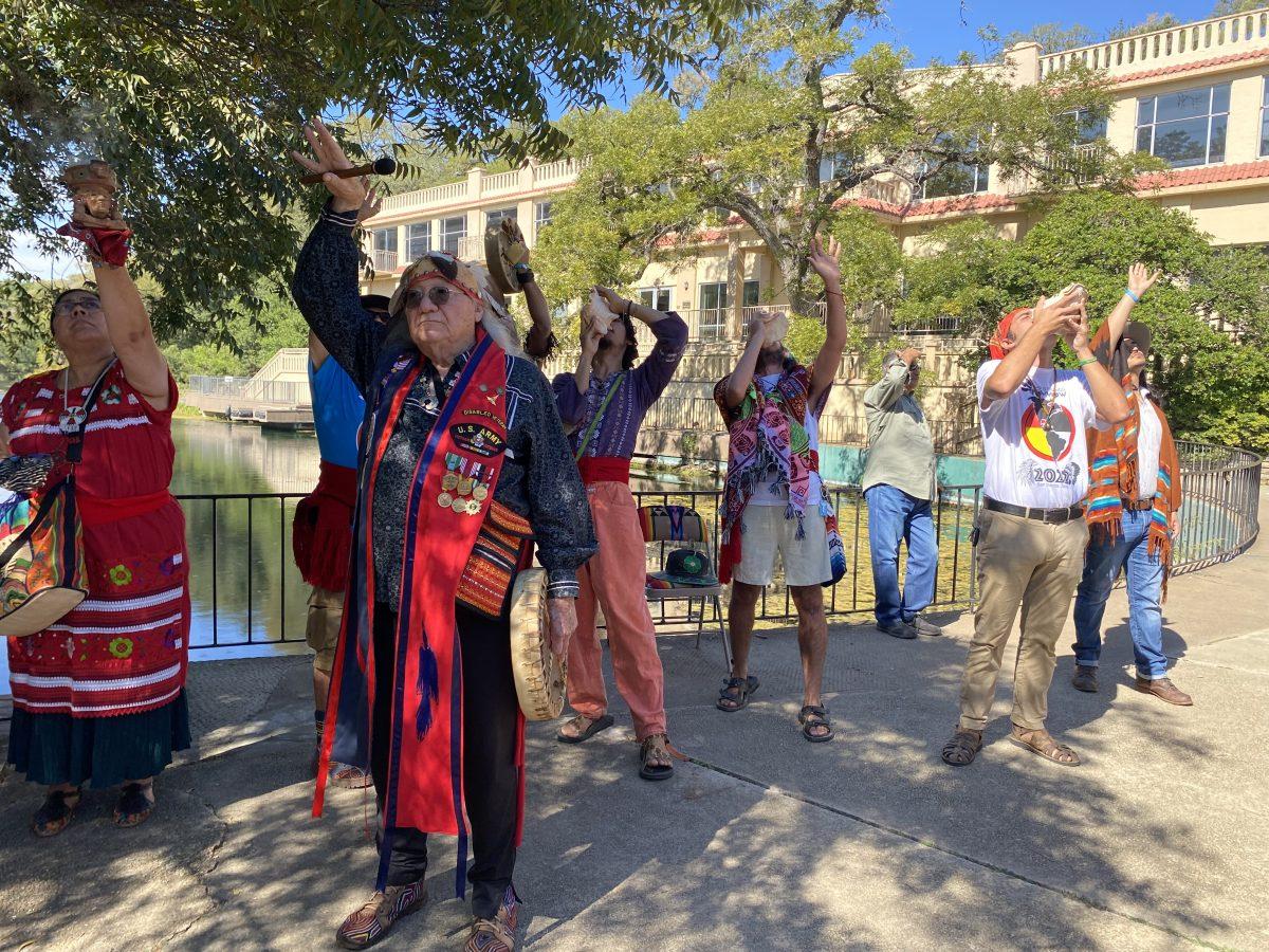 Principal founder of the Indigenous Cultures Institute Mario Garza kicks off day two of the 12th annual Sacred Springs Powwow, Sunday, Oct. 2, 2022. Each Powwow begins with this tradition of the blowing of conch shells in four directions offered as a blessing.