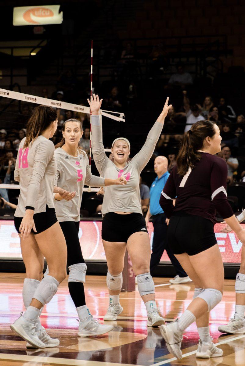 Texas State senior setter Emily DeWalt (17) celebrates after the Bobcats score during a match against James Madison University, Saturday, Oct. 1, 2022, at Strahan Arena. The Bobcats tied the weekend series 1-1.
