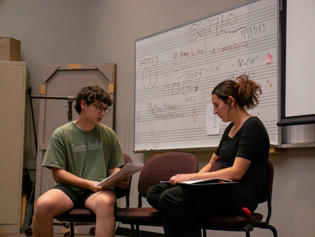 Texas State acting major Seth Lewis (left) and theater performance junior Montserrat Luna (right) discuss their performance on Friday, Oct. 21, 2022, at the Theatre Center.