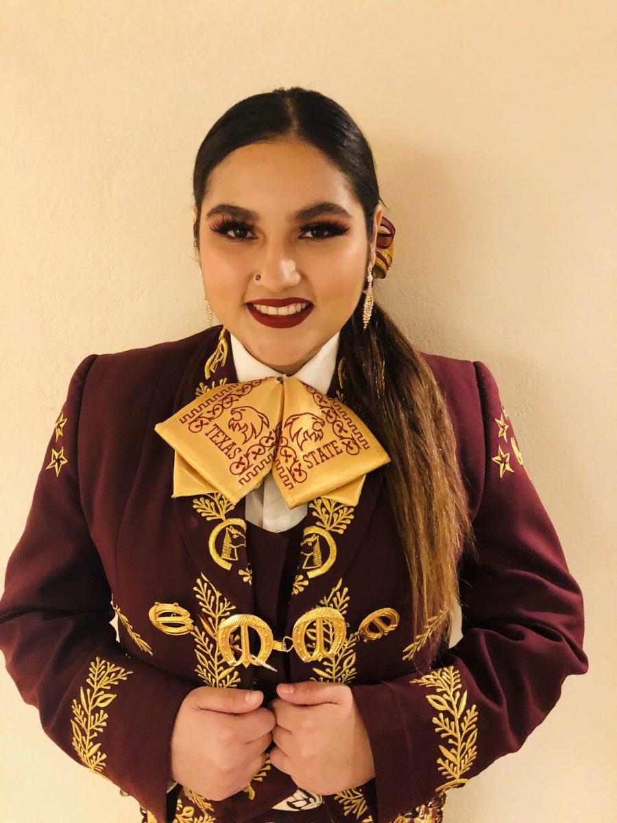 Texas State education junior Daisy Solomon wears her Traje de Charro for the Mariachi Nuevo Generación performance, Sunday, Sept. 25, 2022, at The Wittliff Collections inside Alkek Library.
