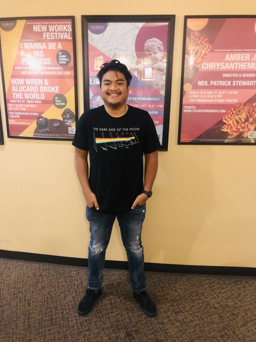 Texas State theater sophomore Richard Prasedyoko smiles for a photo while he waits for a Texas State Film Club meeting to start, Thursday Nov. 3, 2022, at the Theatre Center. 