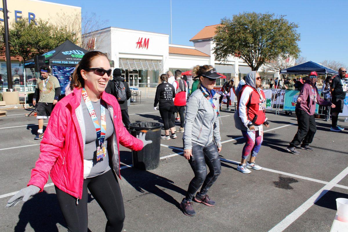Runners participate in a dance contest during an afterparty for the Scallywompus San Marcos Half Marathon, Sunday, Feb. 6, 2022, at the Tanger Outlets. 