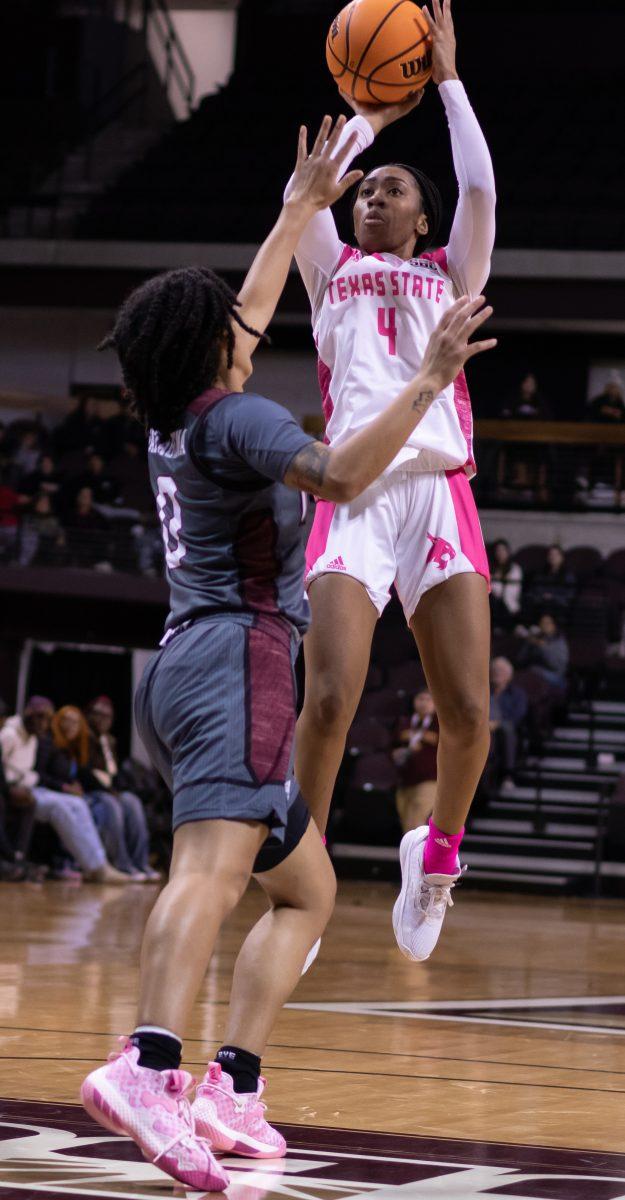 Texas State junior guard Sierra Dickson (4) shoots the ball against Troy University, Thursday, Feb. 2, 2023, at Strahan Arena. The Bobcats lost 84-78.