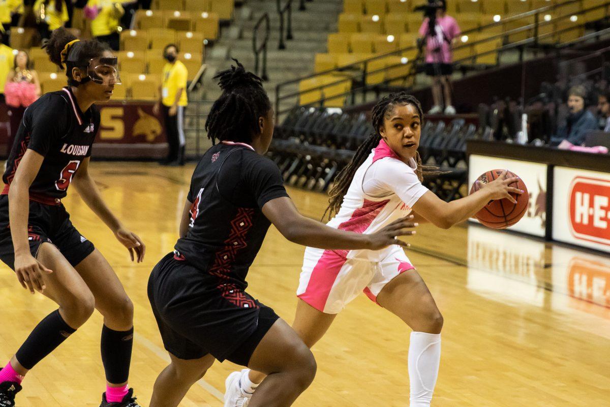 Texas State senior guard Kennedy Taylor (3) looks for an open teammate to pass the ball to during a game against the University of Louisiana, Thursday, Feb. 10, 2022, at Strahan Arena. The Bobcats won in OT 72-71.