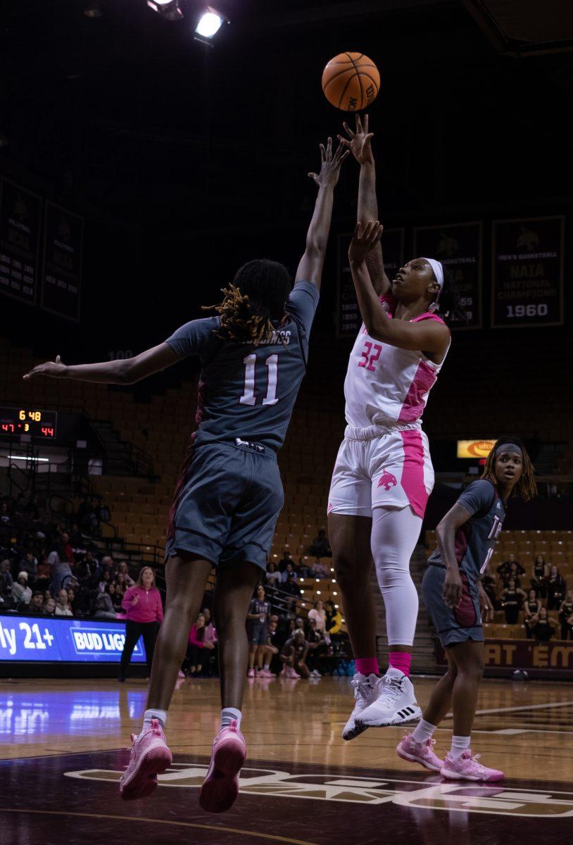 Texas State graduate student forward DaNasia Hood (32) shoots the ball over a Troy defender, Thursday, Feb. 2, 2023, at Strahan Arena. The Bobcats lost 84-78.