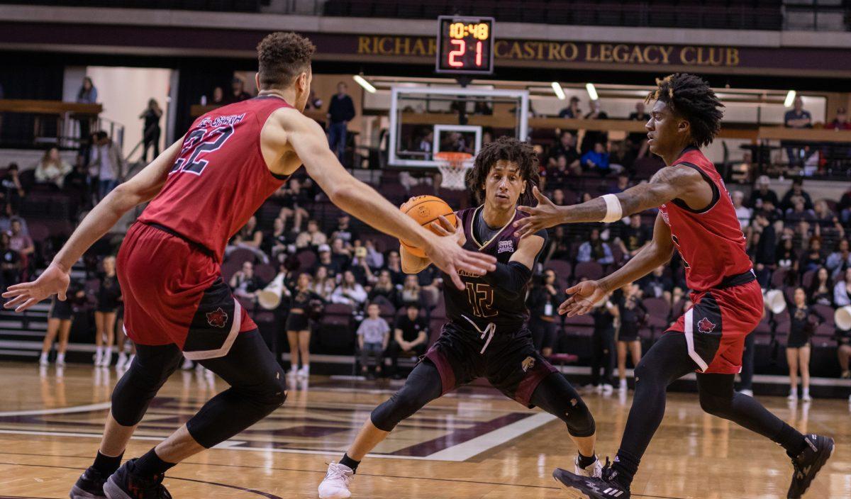 Texas State senior guard Mason Harrell (12) gets double teamed by a pair of Arkansas State defenders, Thursday, Feb. 9, 2023, at Strahan Arena. The Bobcats won 66-62.