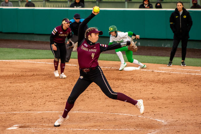 Texas State junior pitcher Jessica Mullins (4) winds up to pitch the ball during the home opener against the University of Oregon, Thursday, Feb. 17, 2022, at Bobcat Softball Stadium. 