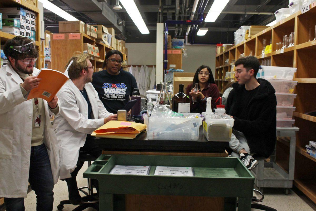 Texas State chemistry students work in the stockroom of the College of Science and Engineering department on Friday, Feb. 10, 2023, in Centennial Hall.