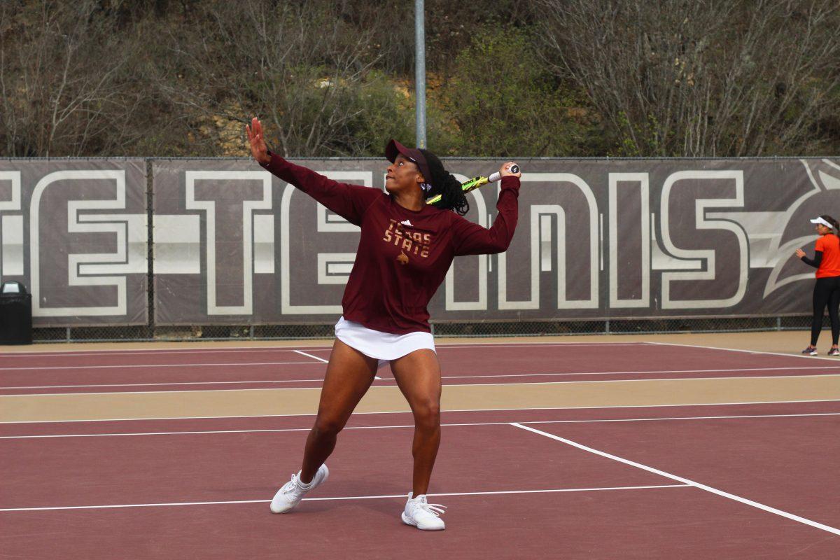 Texas State junior Kiana Graham sets position to forehand the ball, Saturday, Feb. 18th, 2023, against the University of Texas Rio Grande Valley.
