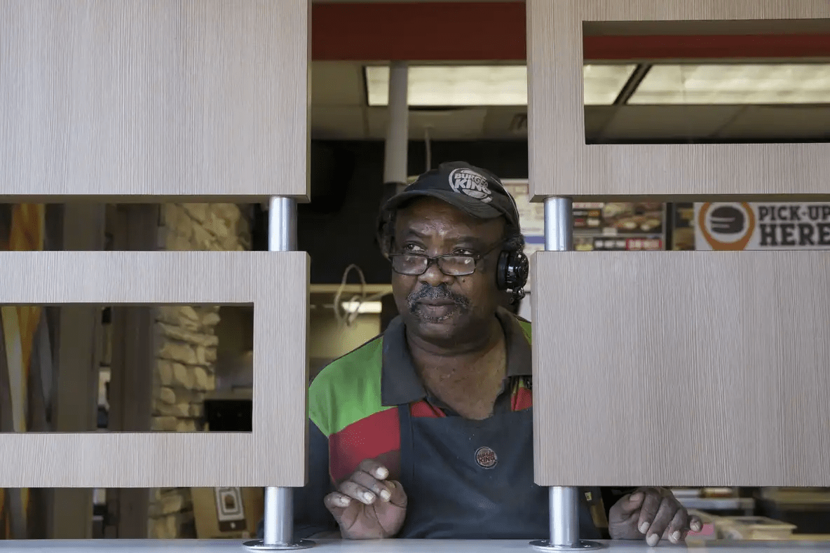 Ernest Kimble keeps an eye out for customers at his job at Burger King in San Marcos in Dec. 2018.