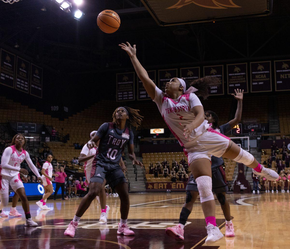 Texas State graduate guard Taelour Pruitt (2) shoots a floater layup against Troy University, Thursday, Feb. 2, 2023, at Strahan Arena. 