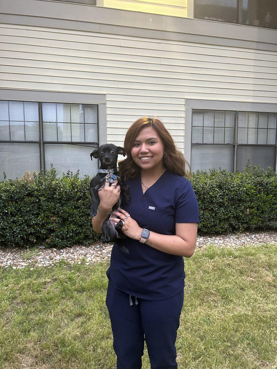 Marleny Martinez poses with her dog Nebula, Tuesday, April 4, 2023 at her apartment in San Marcos.