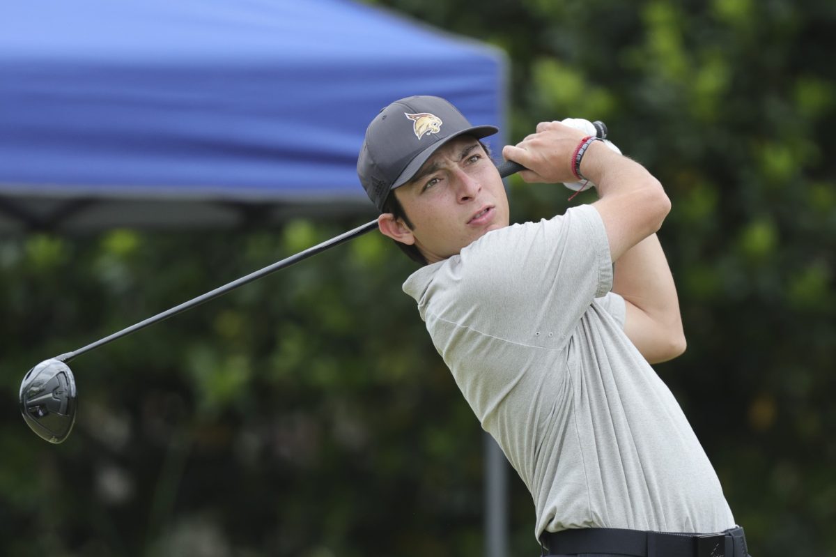 Junior golfer Marcelo Garza watches the ball after hitting it at the Sun Belt Championship, Sunday, April 23, 2023. 