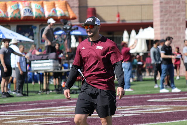 Texas State head coach GJ Kinne walks around the field before the spring game, Saturday, Apr. 22, 2023, at Bobcat Stadium.