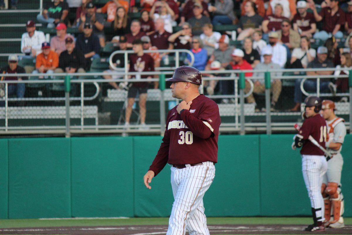Texas State baseball head coach Steven Trout watches the game against Texas unfold, Monday, April 10, 2023, at Bobcat Ballpark.