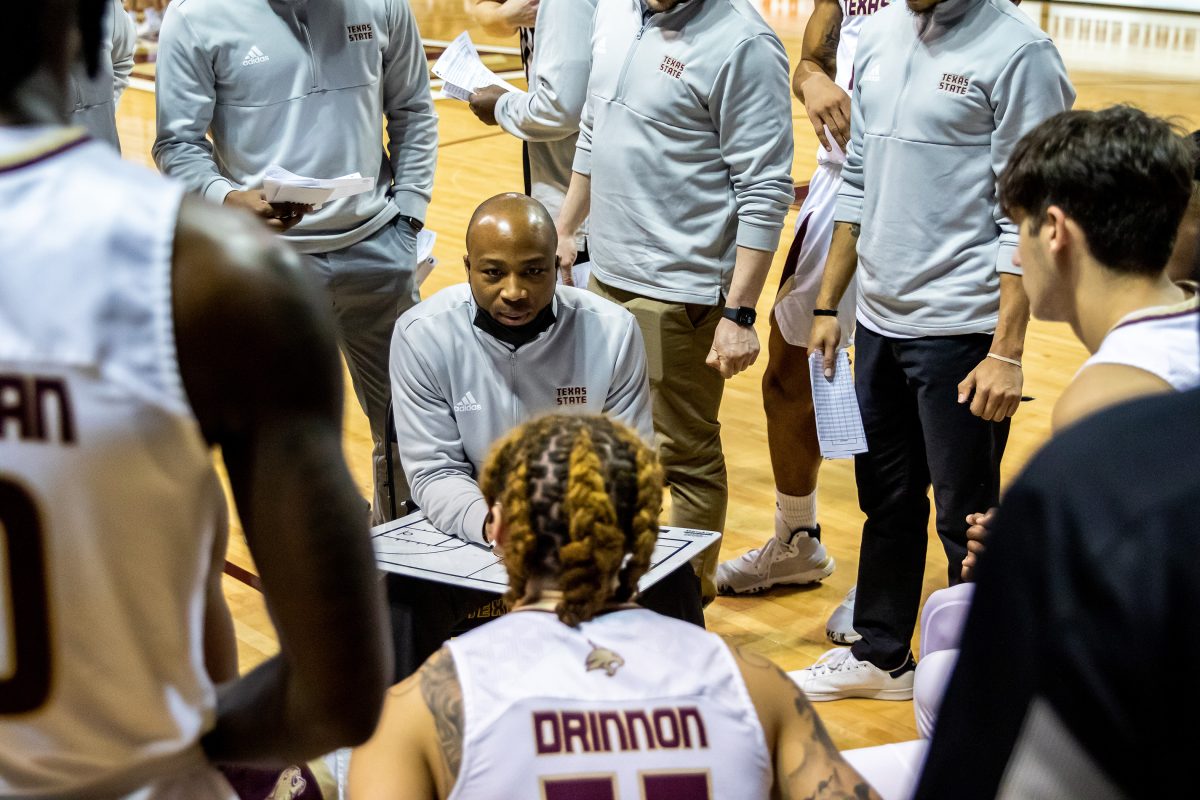 Texas State mens basketball head coach Terrence Johnson talks strategy over a timeout during a game against Coastal Carolina, Sat. Feb 5, 2022, at Strahan Arena. The Bobcats won 69-64.