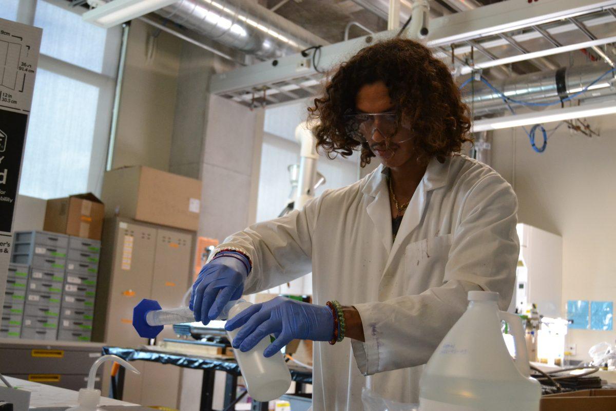 Texas State graduate student Carlos Espindola prepares chemicals for the advanced water purification system, Friday, June 2, 2023, at the Ingram School of Engineering.