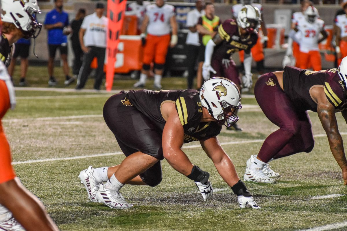 Texas State redshirt junior defensive tackle Levi Bell (54) lines up on the line of scrimmage in a three point stance prepared to rush the quarterback once the ball is snapped against Houston Christian University, Saturday, September 24, 2022, at Bobcat Stadium.  