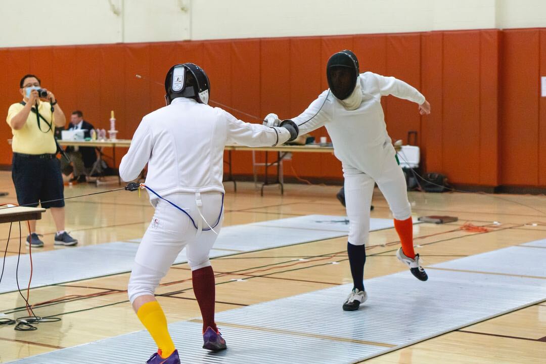 Texas State fencing club president Tim Grimshaw duels a UTSA opponent, Oct. 23, 2021, at Belmont Hall in Austin, Texas.