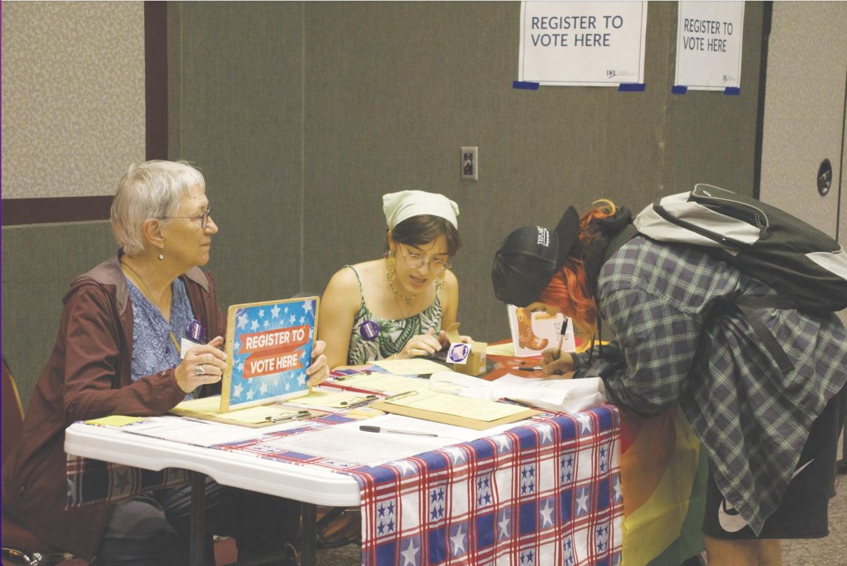 Student Leader for Texas Rising at TXST Adriana Montoya and Deputized Voter Registrar for Hays County Diann McCabe help students register to vote, Wednesday, Sept. 13, 2023, at HSI Community Day hosted in the LBJ Student Center Ballroom.