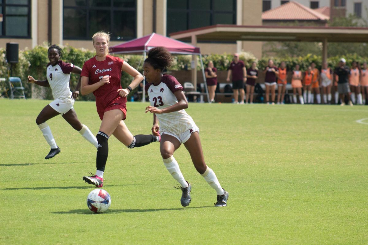 Texas State junior forward Zoe Junior (23) dribbles the ball past a Louisiana-Lafayette defender during the game, Sunday, Sept. 17, 2023, at Bobcat Soccer Complex.