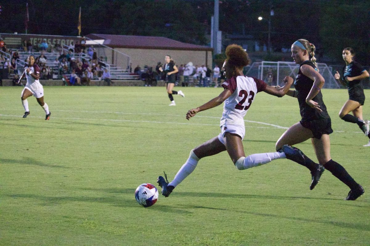 Texas State junior forward Zoe Junior (23) attempts to pass the ball to a teammate against ULM, Thursday, Oct. 5, 2023, at Bobcat Soccer Complex.