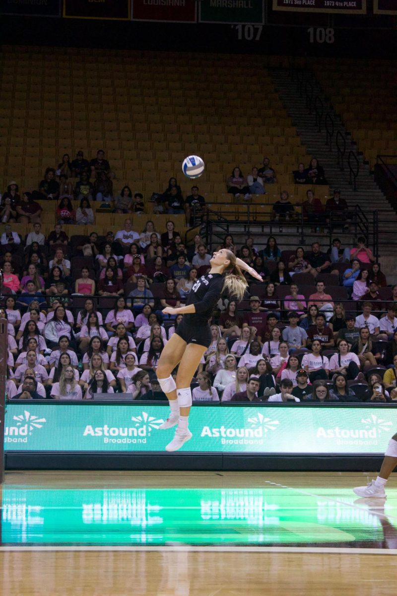 Texas State sophomore middle blocker Bailey Hanner (20) spikes the ball over the net during the game against the South Alabama, Friday, Oct. 20, 2023 at Strahan Arena.