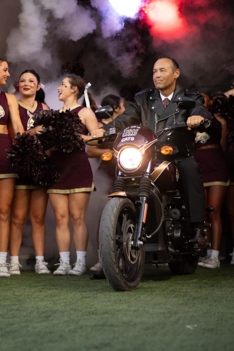 Texas State President Kelly Damphousse prepares to ride across the football field, Saturday, Sept. 16, 2023, at Bobcat Stadium. 